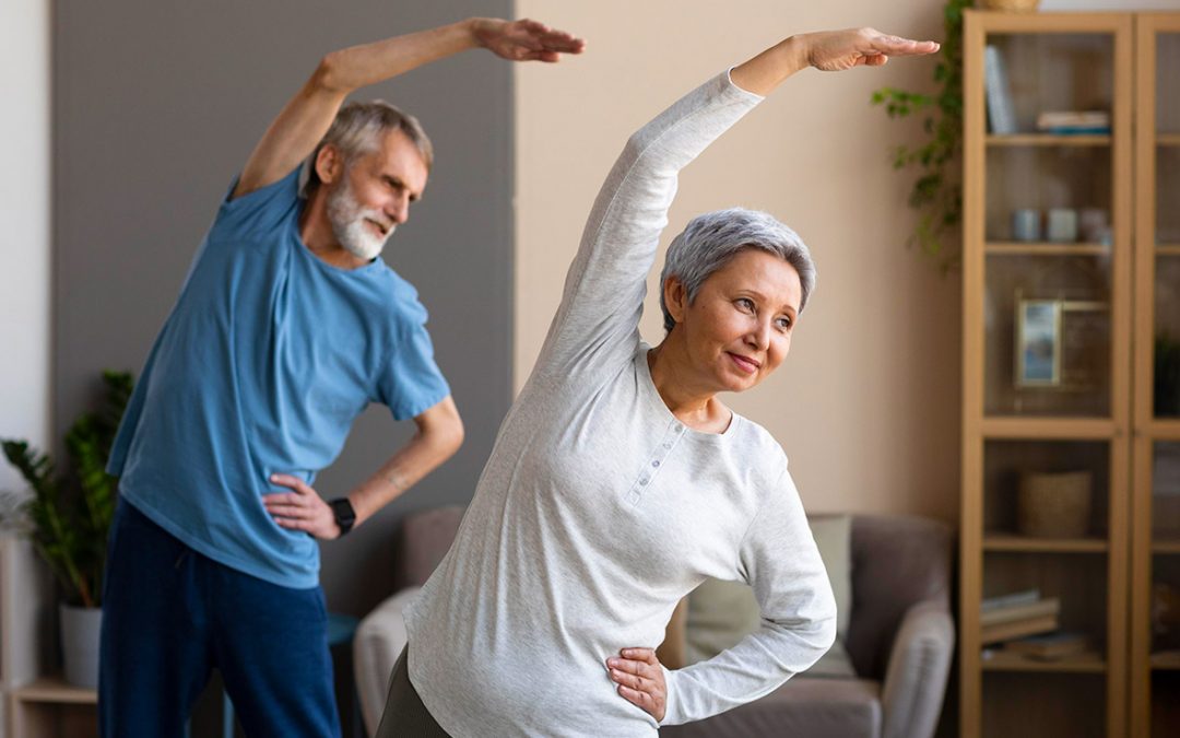 older couple exercising together at home